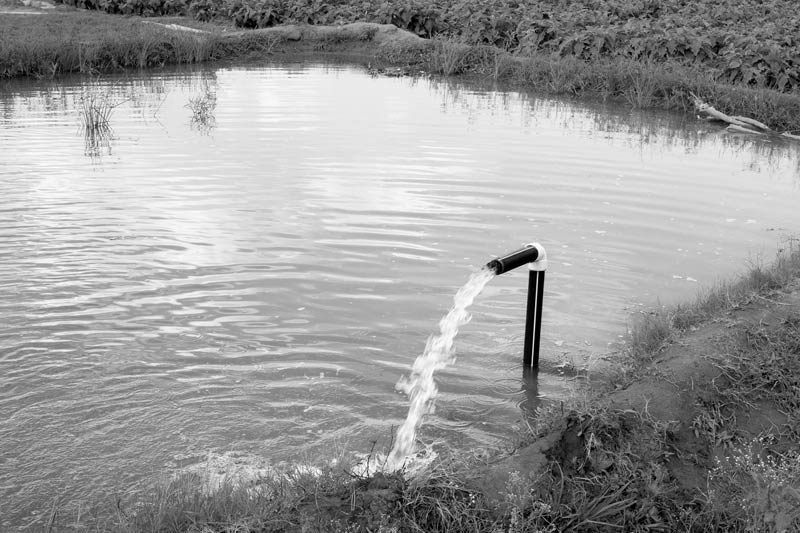 Impact of Green Revolution on Water Resources in India - tubewell extracting groundwater for irrigation in drought-prone Kolar district, Karnataka